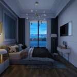 A bedroom with a large window Description automatically generated