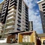 A group of tall buildings Description automatically generated